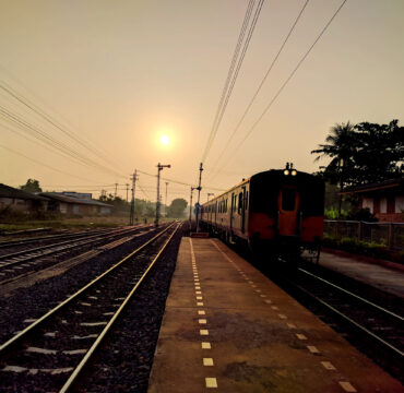 train and railway station at sunset